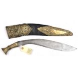 A kukri, blade 14", with short twin back fuller, sheet brass covered hilt embossed with stylized