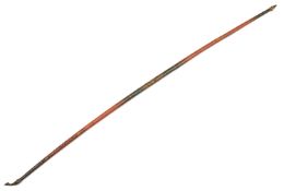 A good Ceylonese long bow. 19th century, 185cms, horn nocks, decorated overall with "Kandy ware"
