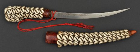 A North African littoral dagger. early 20th century, curved SE blade 26cms engraved and inlaid