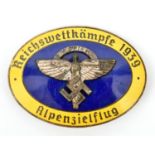 A Third Reich pin back oval enamelled badge, superimposed in the centre is the NSFK symbol on blue