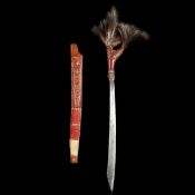 A Dyak head-hunter?s sword Mandau. 20th century, swollen SE blade 46.5cmswith incised scroll