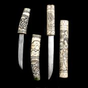 A Japanese Ainu carved bone dagger. Blade 12cms, hilt and sheath carved with 3 stylised dragons
