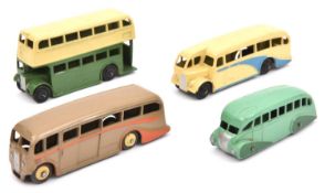 4 Dinky Toys buses. 29b, Streamlined bus in two-tone green. 29c, Double Decker bus in cream and