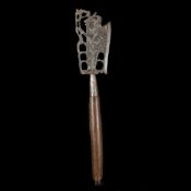 A Balinese ceremonial axe. 20th century, broad iron head pierced and silver damascened with a wayang