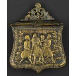 A Greek cast brass cartouche palaska.19th century, 10cms, the front with a relief scene of