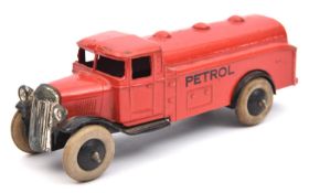 A Dinky Toys petrol tanker (25d). A post-war example in red with pre-war black base plate and
