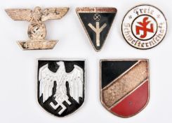 A Third Reich bar to the 1914 Ist Class Iron Cross; 2 metal shield badges for the tropical helmet;