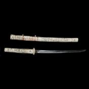 A decorative Japanese carved bone sword. First half of the 20th century, blade 39.5cms (not forged