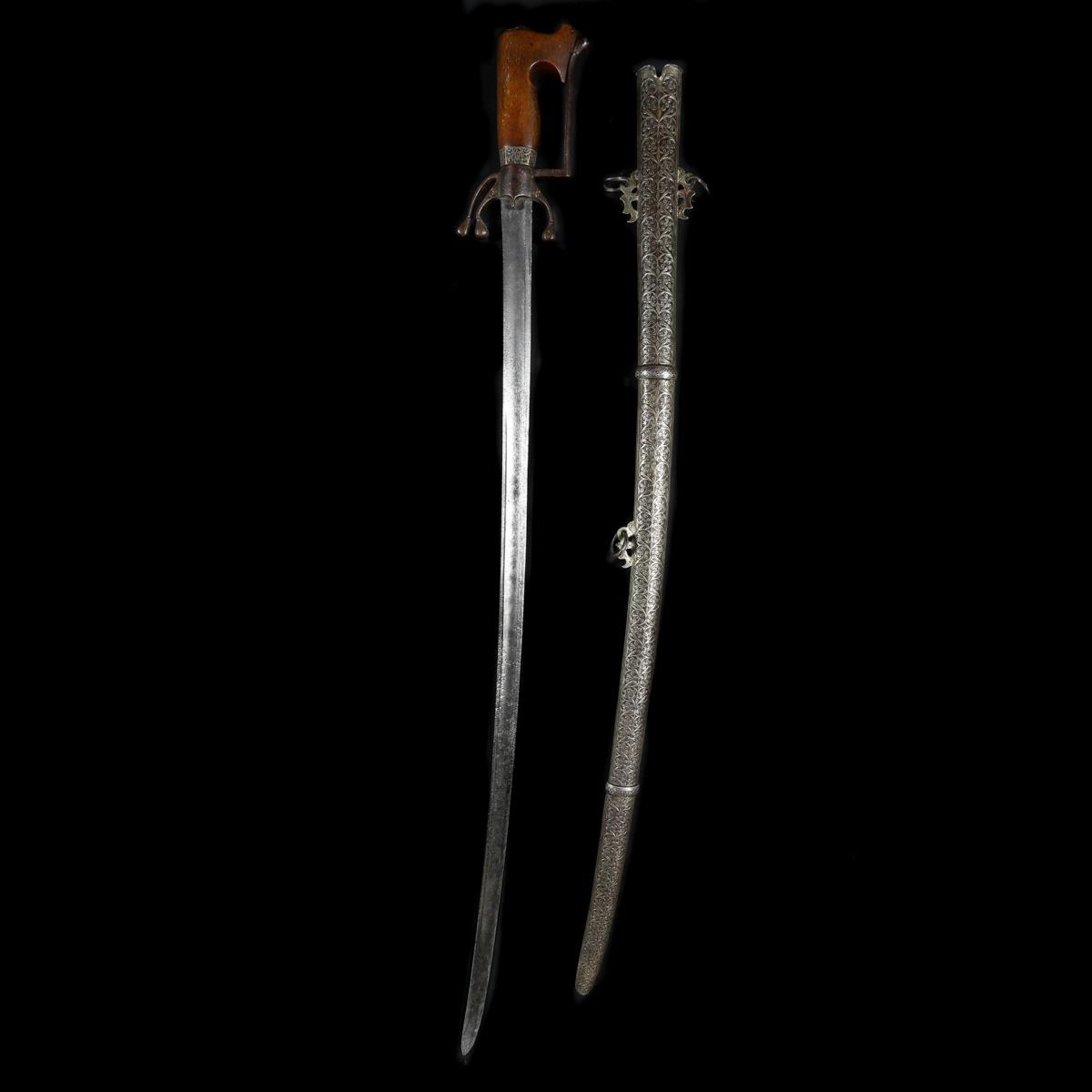 A Moroccan sword nimcha. Second half of the 19th century, slightly curved SE blade 94.5cms cut - Image 2 of 3