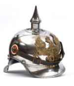 A WWI Prussian Cuirassier's helmet, of steel with brass line eagle badge, national and state