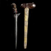 A Balinese dagger kris. Straight pamor blade 37.5cms probably 19th century, wooden hilt carved as