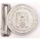 A Third Reich 1938 pattern Red Cross Leader's aluminium belt buckle, the back stamped "Ges. Gesch"