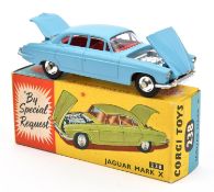 A Corgi Toys Jaguar Mark X (238). With light blue body and red interior. Including suitcase and