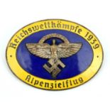 A Third Reich pin back oval enamelled badge, superimposed in the centre is the NSFK symbol on blue