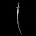 An Indian hunting sword tulwar shikargar. Late 19th century, curved SE blade 69cms chiselled overall