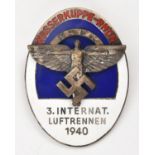 A Third Reich pin back oval enamelled badge, superimposed in the centre is the NSFK symbol, on a