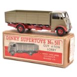 A Dinky Supertoys Guy 4-ton Lorry (511). Example with fawn first type cab and body, and red chassis,