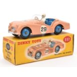 A Dinky Toys Triumph TR2 Sports. 111. Salmon pink body, blue interior and wheels, RN 29. White