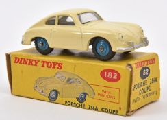 A Dinky Toys Porsche 356A Coupe. 182. An example with cream body and blue wheels. Boxed, some