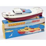 Sutcliffe tinplate clockwork Cruiser. Named 'COMMODORE' in white and red livery, with light blue