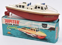 Sutcliffe tinplate clockwork Jupiter Ocean Pilot Cruiser. In white and red, with gold band and