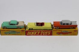2 Dinky Toys American Cars. Studebaker Golden Hawk (169). In light green and cream, wheels over