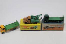 3 Dinky Toys. Guy Flat Truck - with tailboard (513). Dark green cab and chassis with mid green