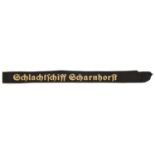 A German woven naval cap tally "Schlachtschiff Scharnhorst", yellow/gold lettering. GC (slightly