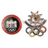 A Third Reich circular enamelled pin back badge, the centre with Olympic stadium and "Berlin"