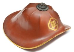 A Japanese retainer's helmet jingasa. Of octagonal kabuto form, up-turned brim, brown lacquered
