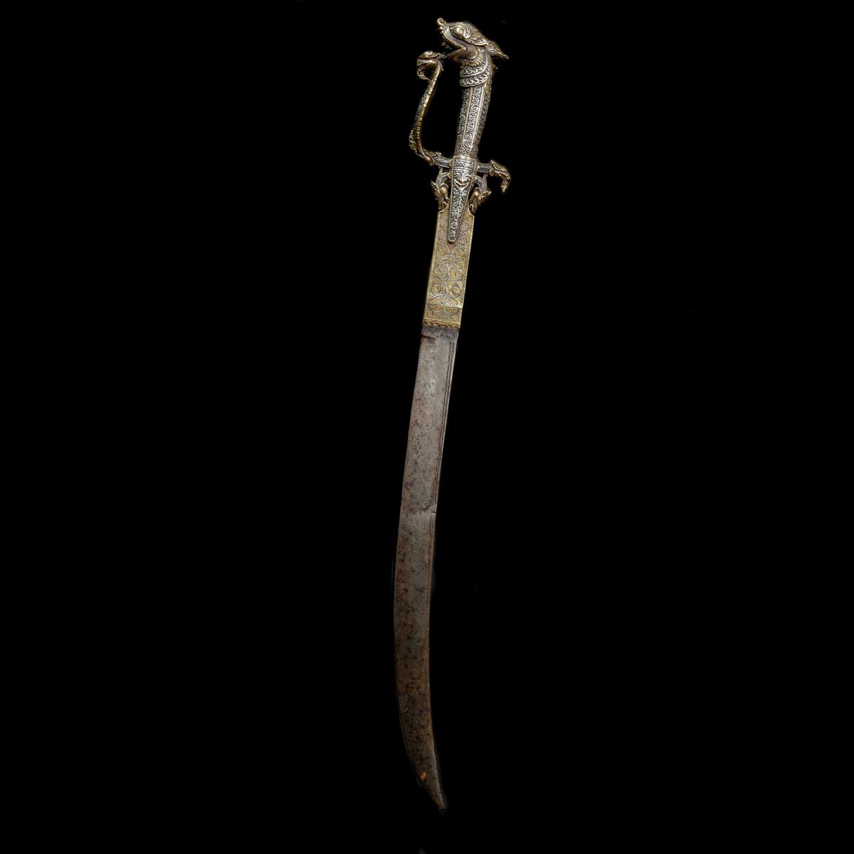 A Ceylonese sword kastane. 19th century, curved SE blade 36cms (cracked), brass hilt and forte - Image 2 of 3