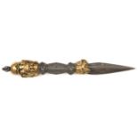 A cast iron Tibetan exorcizing dagger phurbu. 25cms, with 3 brass bodhisatva masks to the pommel,