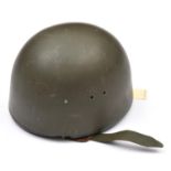 An East German parachutists helmet, olive green finish with matching leather ear flaps and