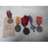 Third Reich medals: German Defences medal, in printed paper packet, Eastern Front medal (oxidised