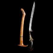 A Sumatran dagger rencong. Aceh 19th century, curved SE blade 22cms, one piece rounded black coral
