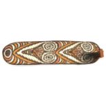 A New Guinea (Sepik river area) wooden shield. Of rectangular form with rounded ends and wicker