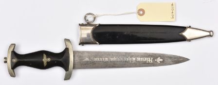 A Third Reich 1933 model SS dagger, the etched Damascus pattern blade bearing SS motto between oak