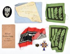 7 items of Third Reich insignia collected by Pilot Officer D.O. Williams c 1944, comprising a pair
