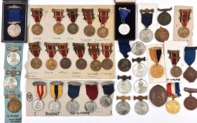 An accumulation of London School Attendance and Good Conduct medals, mostly WM and including many