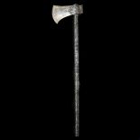 A Persian axe tabar. Qjar dynasty, wootz steel head 14cms, chiselled with lion attacking deer on