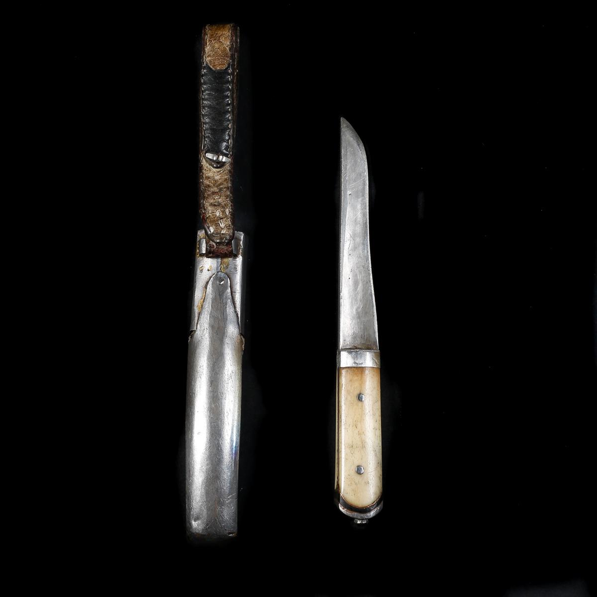 A Tibetan knife, 20th century. Single edge blade 12cms cut with a single fuller, 2 piece bone grips, - Image 2 of 3