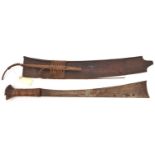 An Indonesian sword parang, SE blade 19", flared to broad concave end, cord bound grip, flared