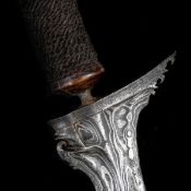 A Balinese dagger kris. Wavy black and silver coloured pamor blade 42cms probably 18th/19th century,