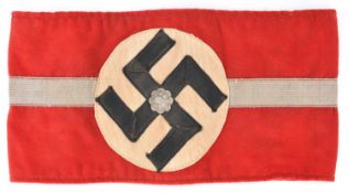 An early 1930's Third Reich NSDAP Leader's armband, with central broad silver stripe, aluminium