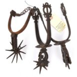 A pair of 19th century South American iron spurs, with 7 spike rowels, pierced rosettes and zig