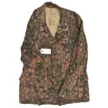 A Third Reich SS four pocket camouflage jacket, with seeded grey metal buttons. GC (some service