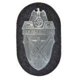 A Third Reich Demjansk arm shield, on Luftwaffe grey/blue cloth patch with paper backing. GC,
