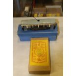 An O gauge 32mm model clockwork tram by A & J van Riemsdyk. A single deck tram finshed in navy