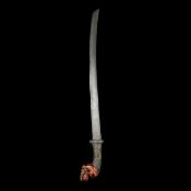 An Indonesian sword parang Late 19th century, slightly curved SE pattern welded blade 56.5cms,
