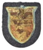 A Third Reich Kuban arm shield, on Luftwaffe grey/blue cloth patch with paper backing. GC,